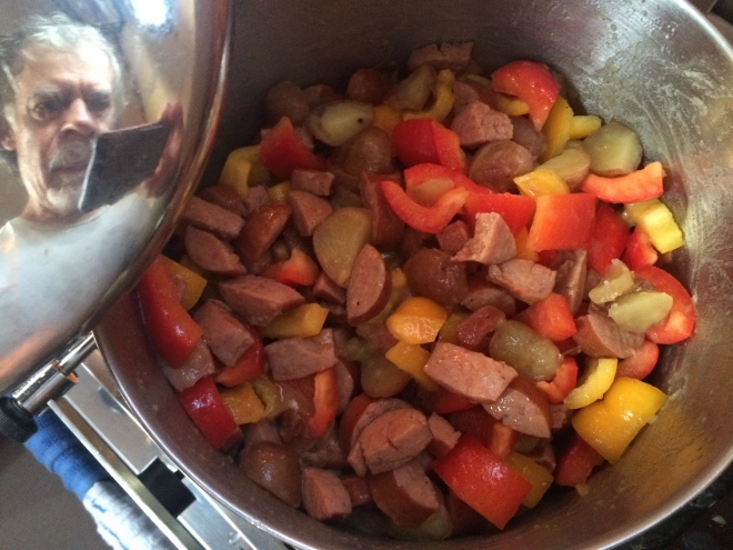 Meanwhile, down in the galley I'm preparing the much-talked-about (by myself) kielbasa dish with peppers and something. It's timed to be ready as we drop anchor in Madosky Bay.